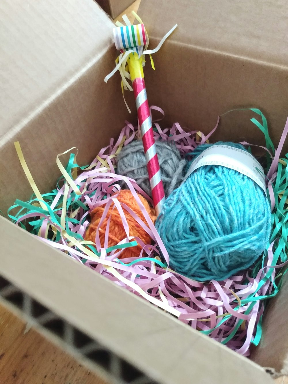 a box of colorful yarn