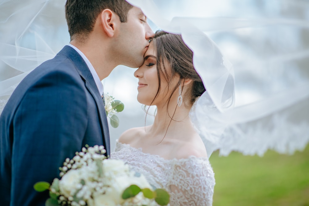 a man and woman kissing