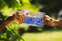 hands holding a card