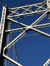 Close-up of detailed steel framework blueprint on a drafting table.