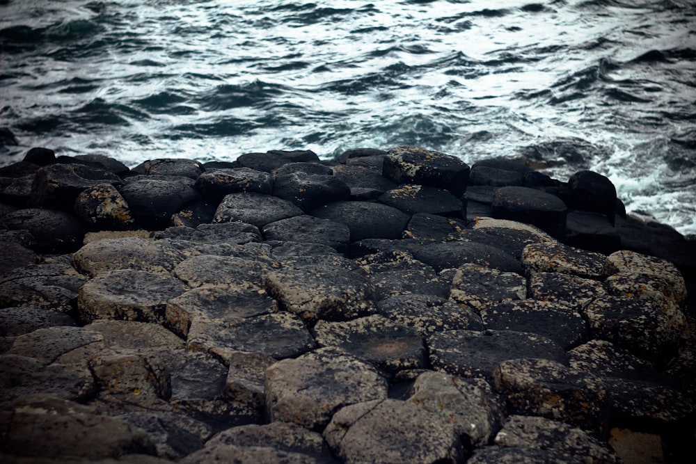 a rocky beach with waves crashing