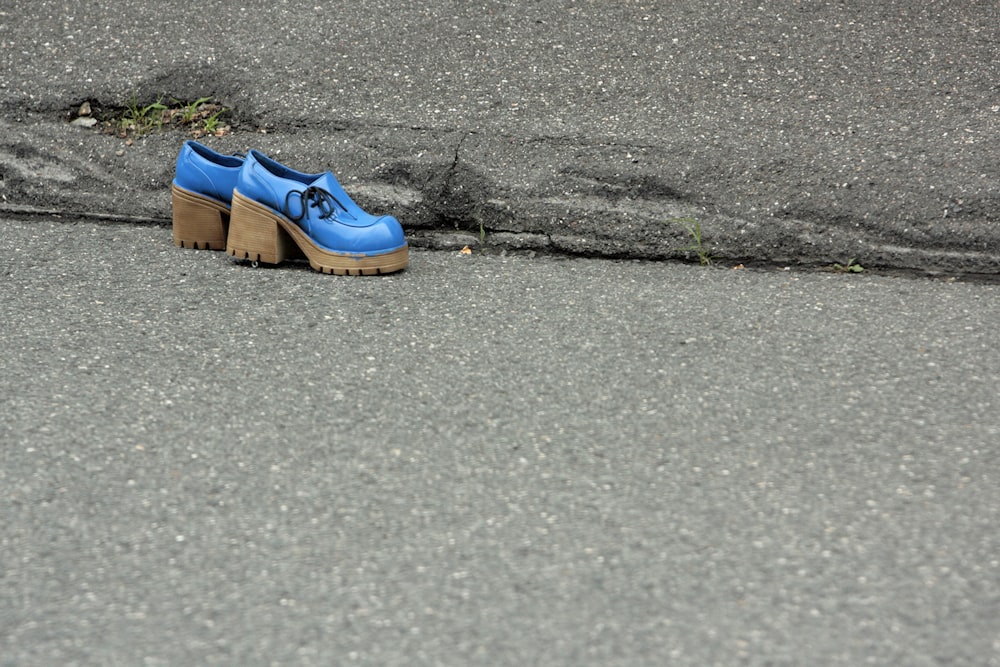 a blue shoe on the ground