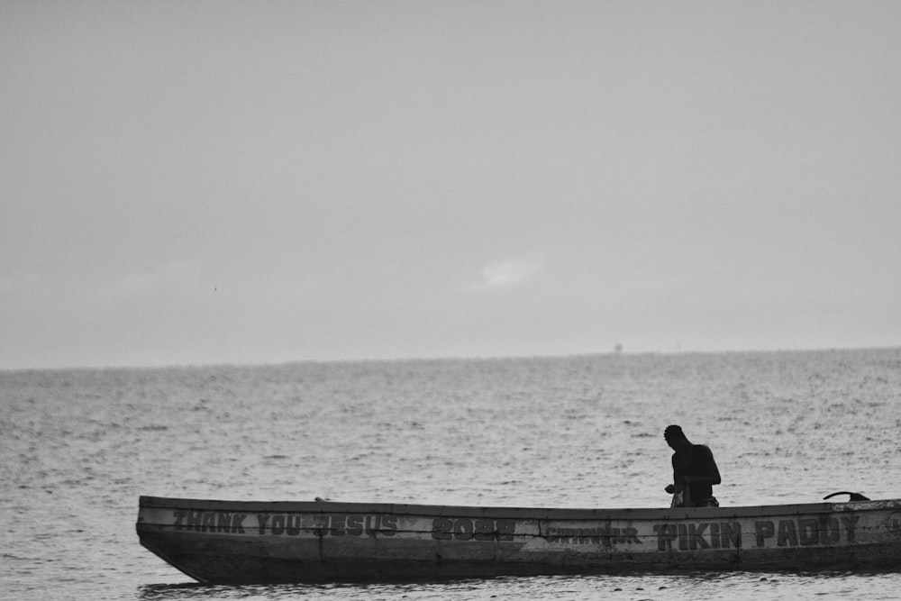 a person sitting on a dock
