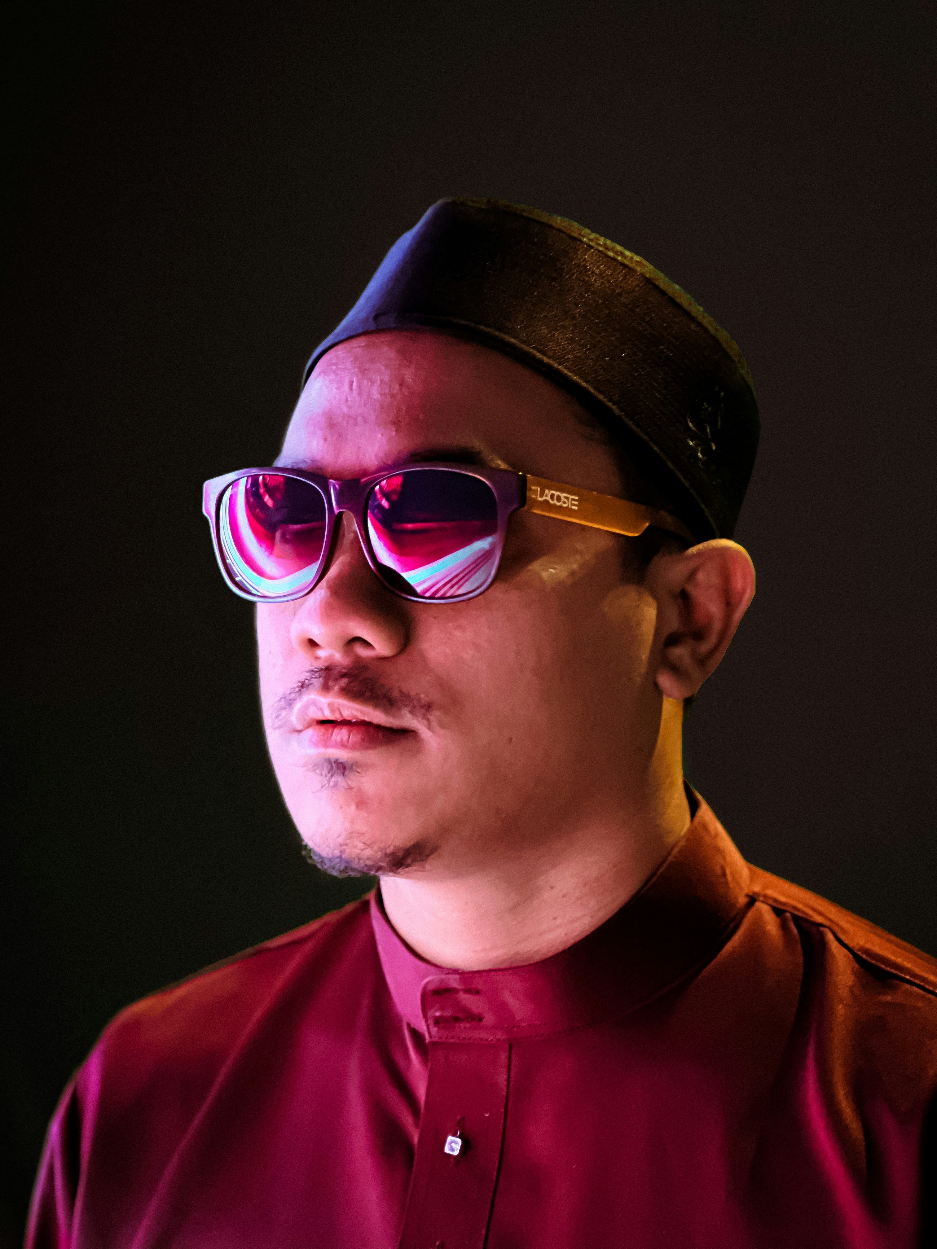 a man wearing sunglasses and a hat