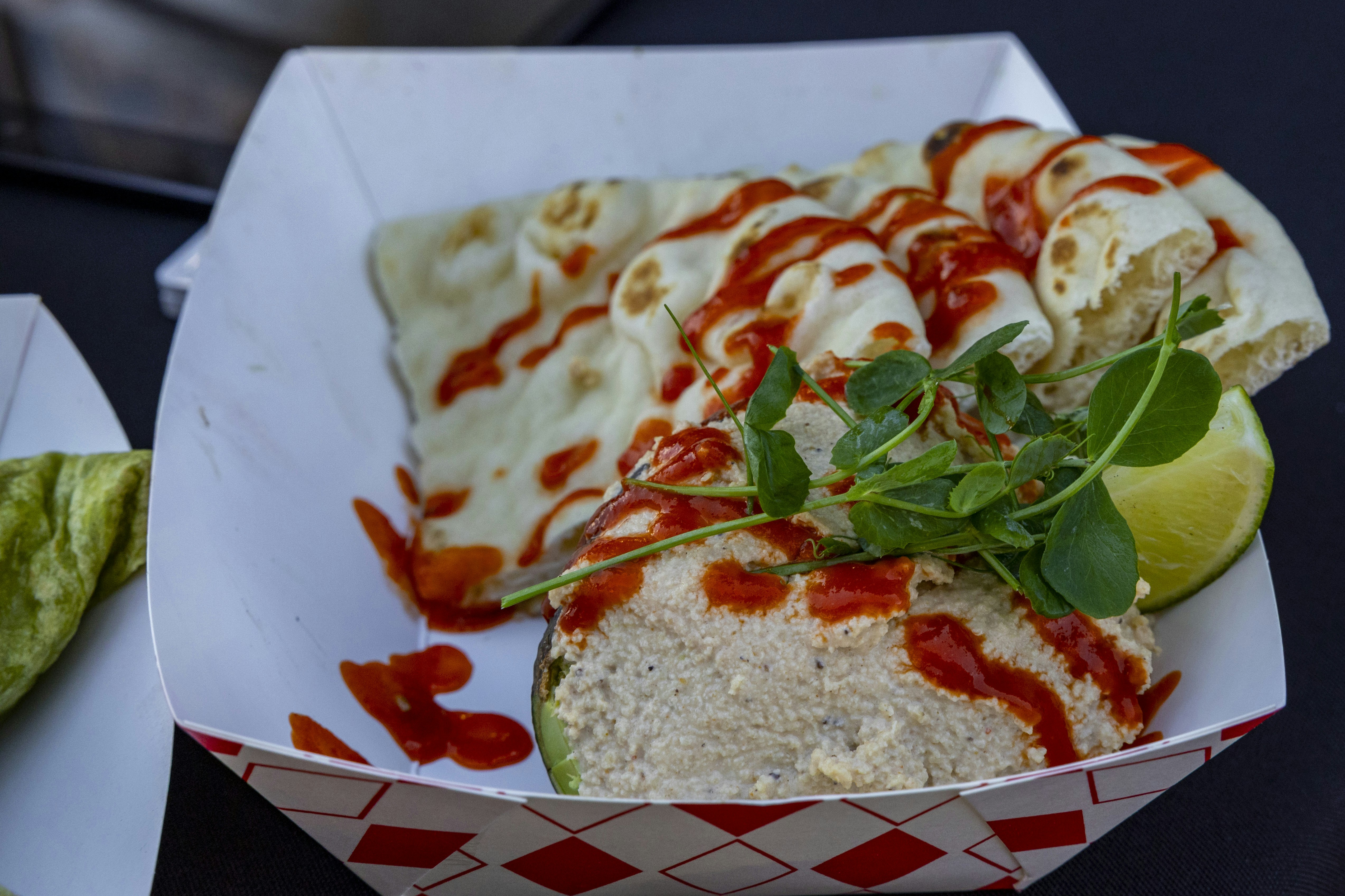 Quesadillas with sauce in a paper boat