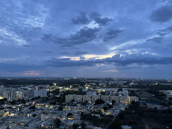 A surreal cityscape fading into a deep cosmic horizon under a fractured sky.