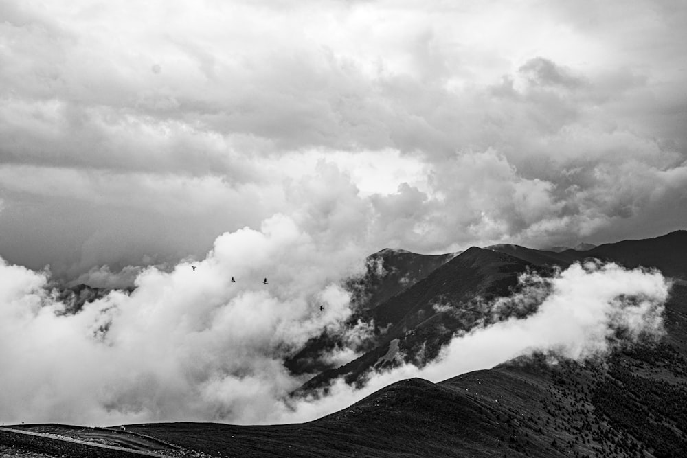 a mountain with clouds above it