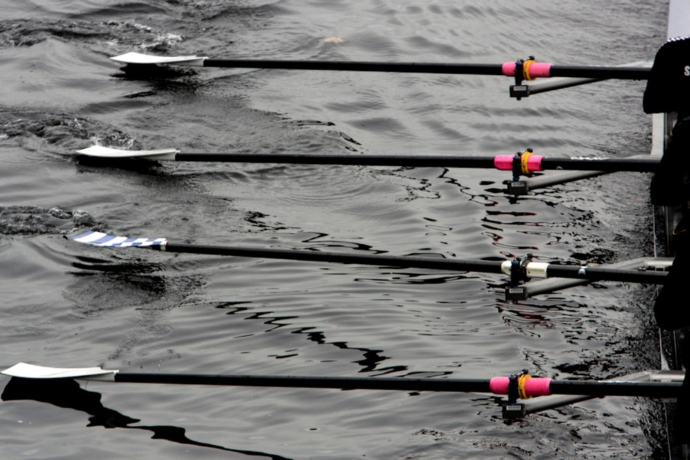 a group of people rowing a boat