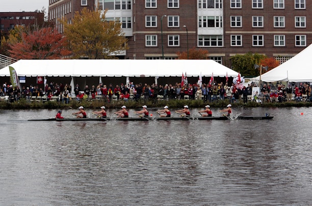a group of people rowing a boat