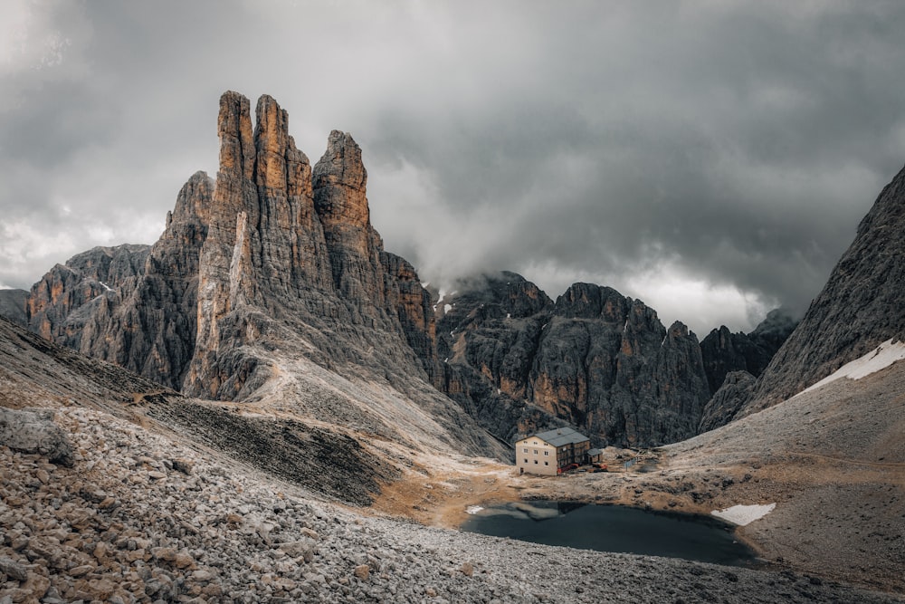 a small house on a rocky mountain