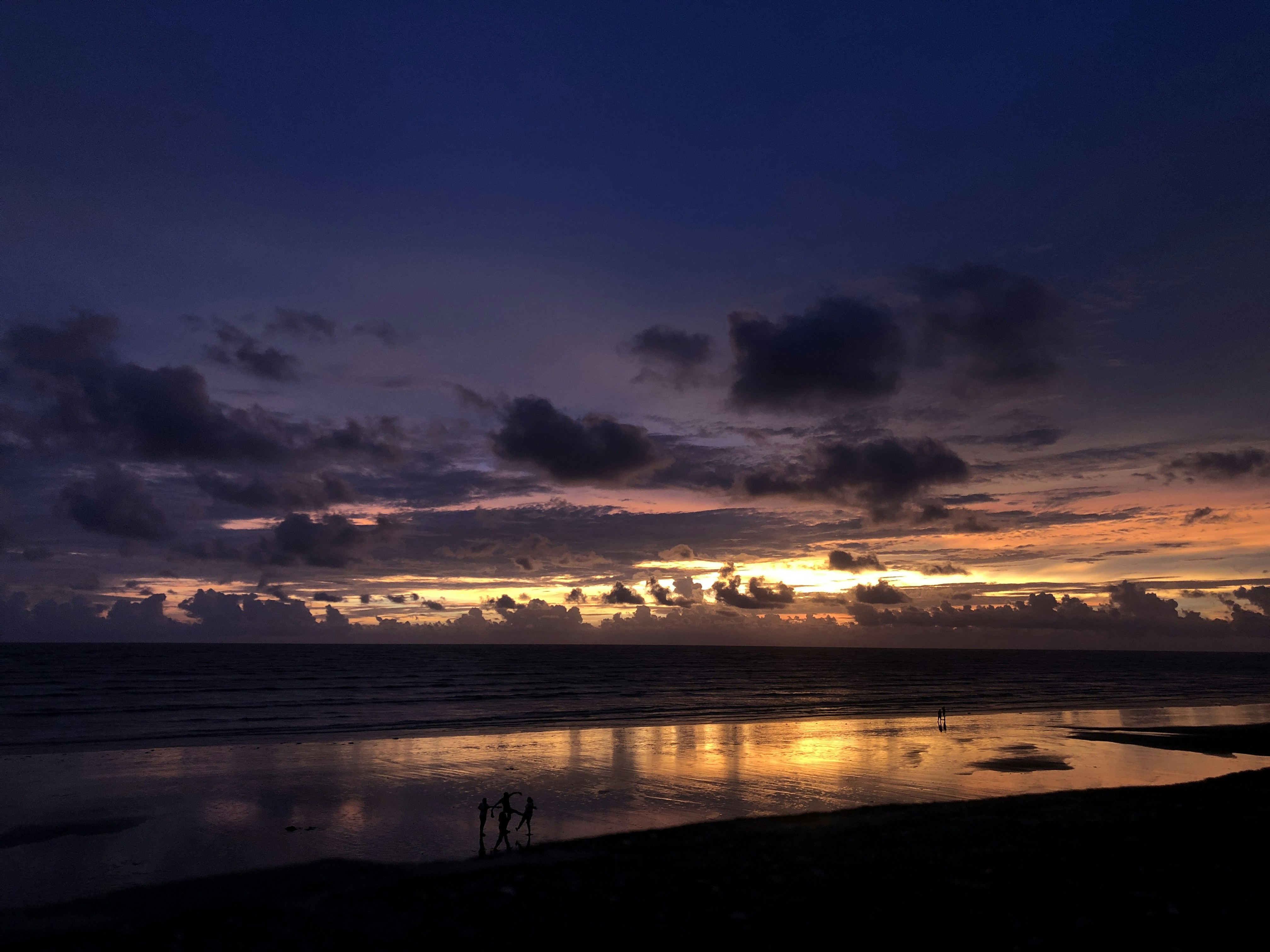 a sunset over a beach
