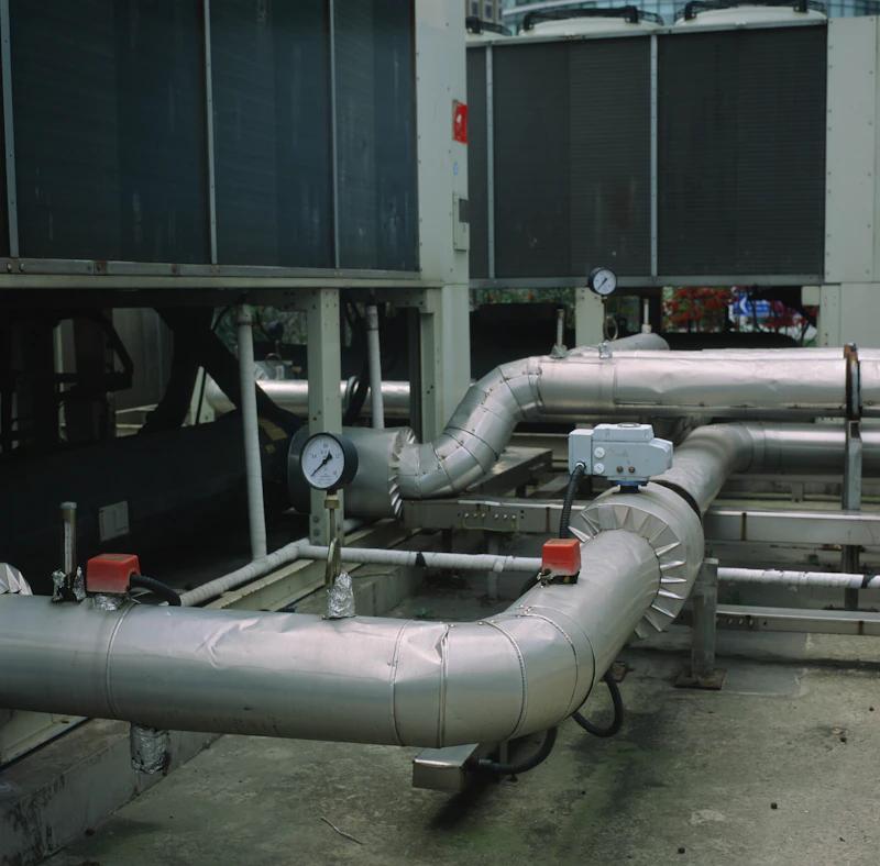 Heavy-duty HVAC ventilation air ducts inside industrial complex