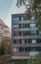 a group of people in front of a brick building