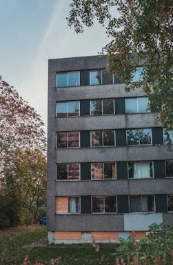 a group of people in front of a brick building