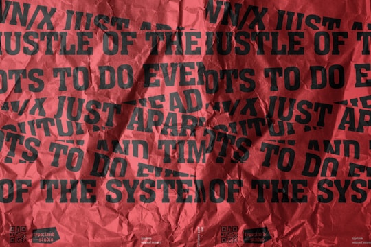 A vibrant red and black marketing poster with bold typography.