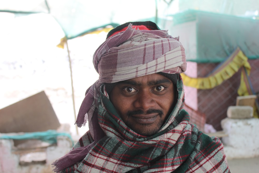 a man wearing a head scarf