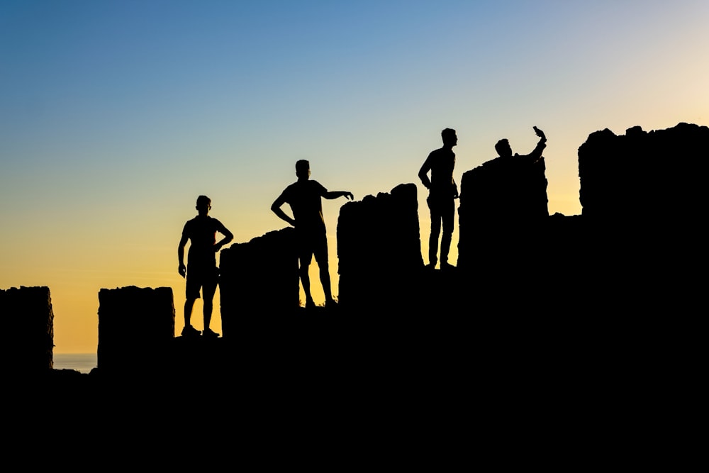 a group of people standing on a hill