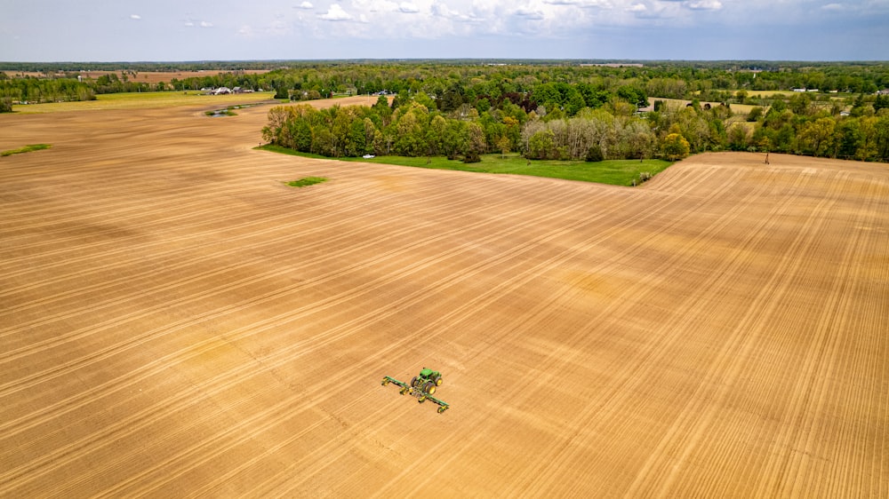 a person riding a machine in a field