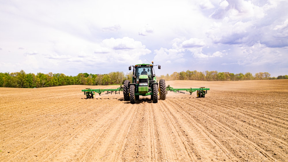 a tractor driving on a dirt road