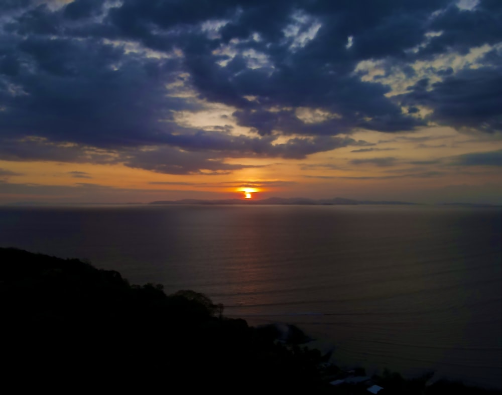 a sunset over a body of water