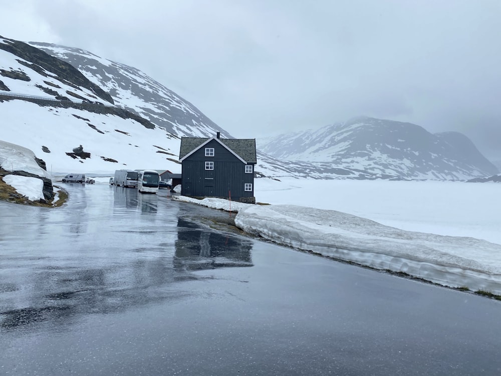 a small building on a snowy mountain