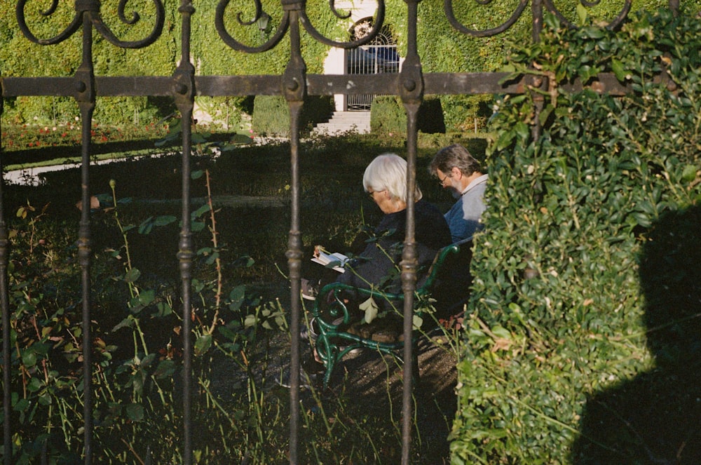 a couple of people in a garden