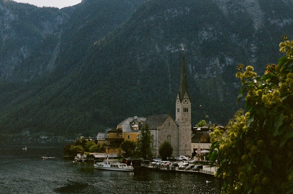 a church on a hill by a lake