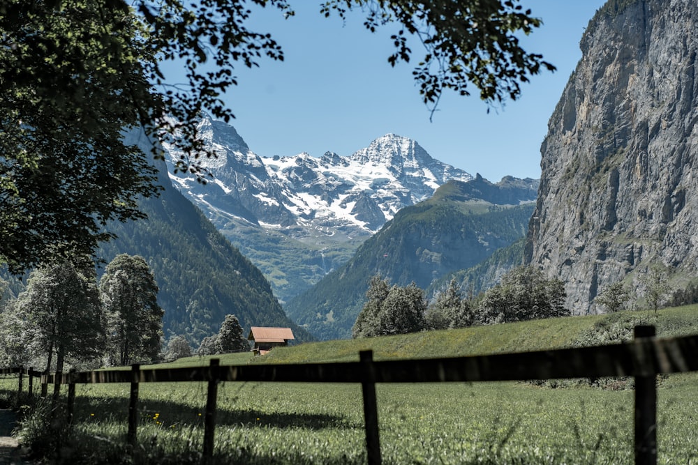 a fence in front of a mountain