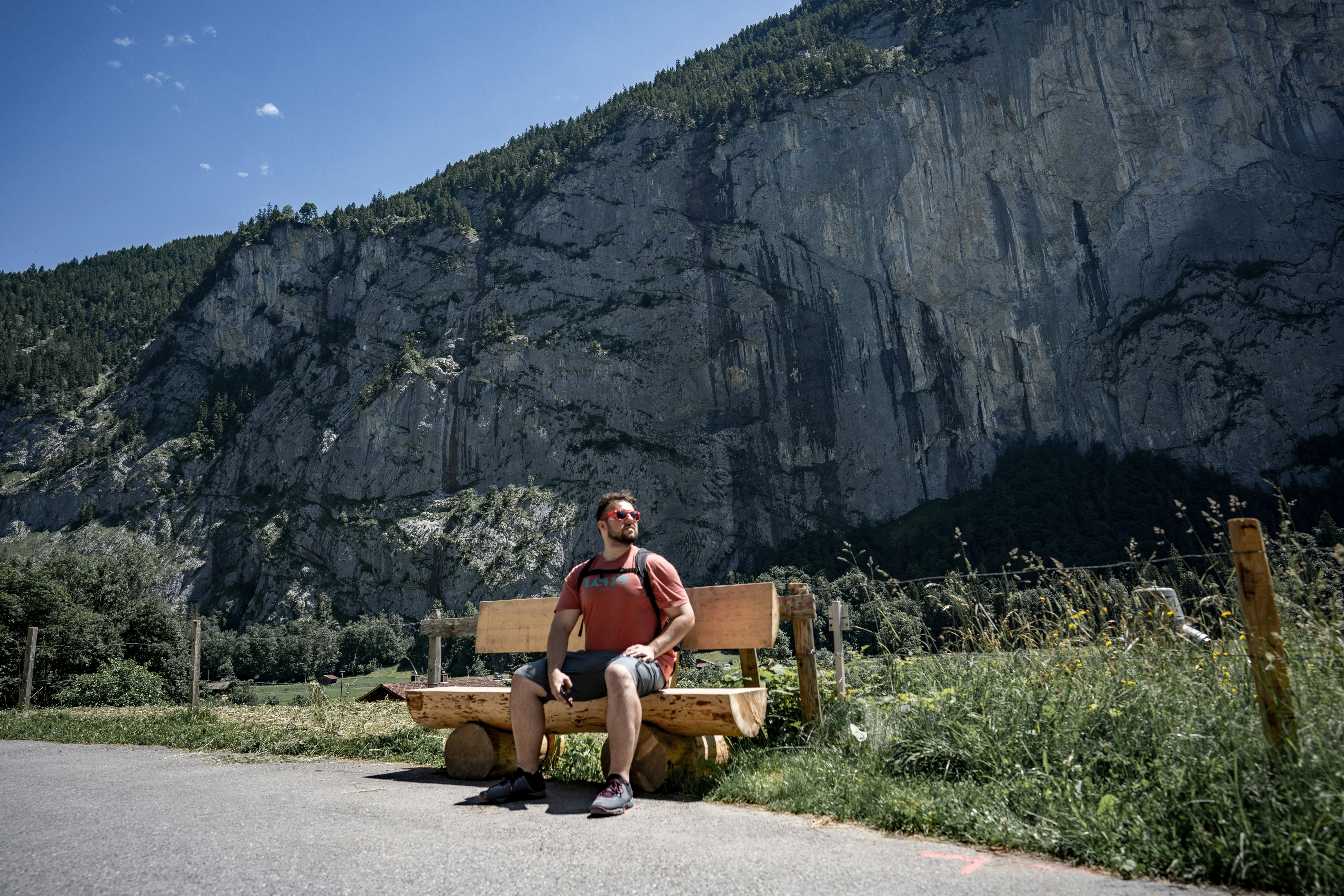 A man sitting on a bench photo – Free Switzerland Image on Unsplash