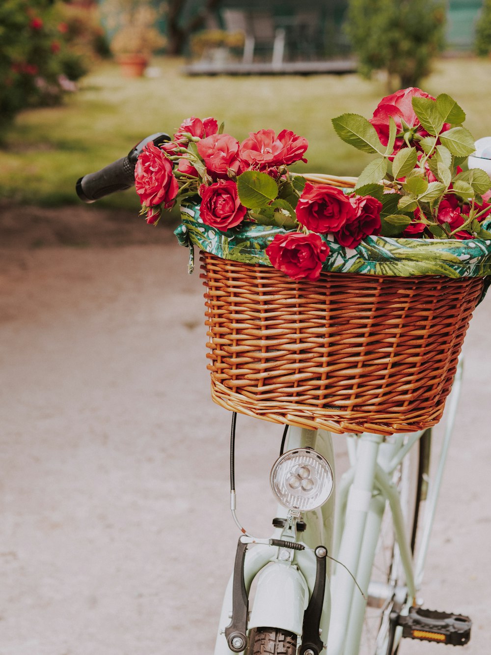 a basket of flowers on a bicycle