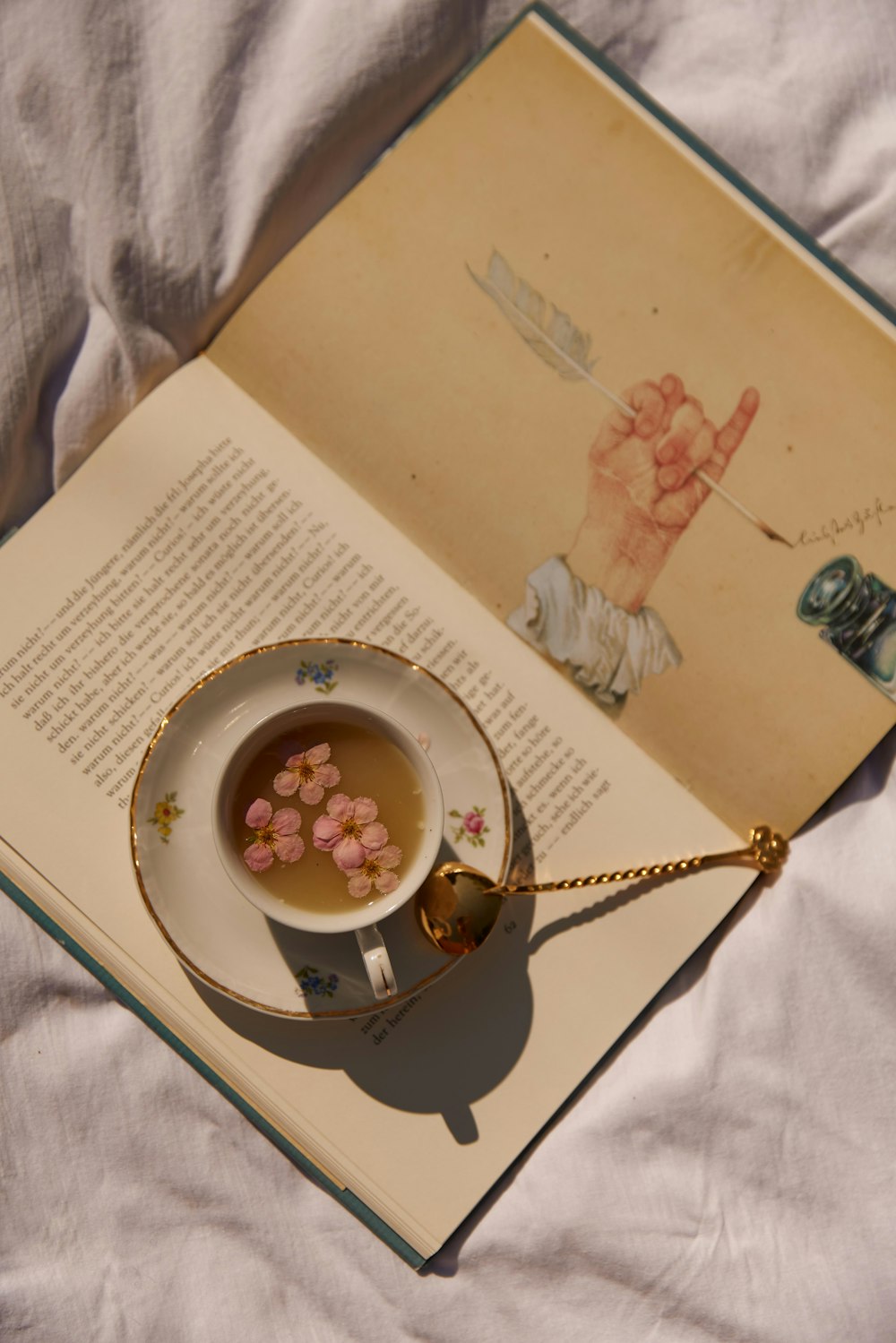 a plate with a picture of a tea set on it