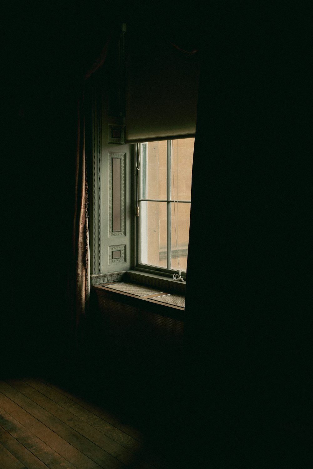 a window in a dark room