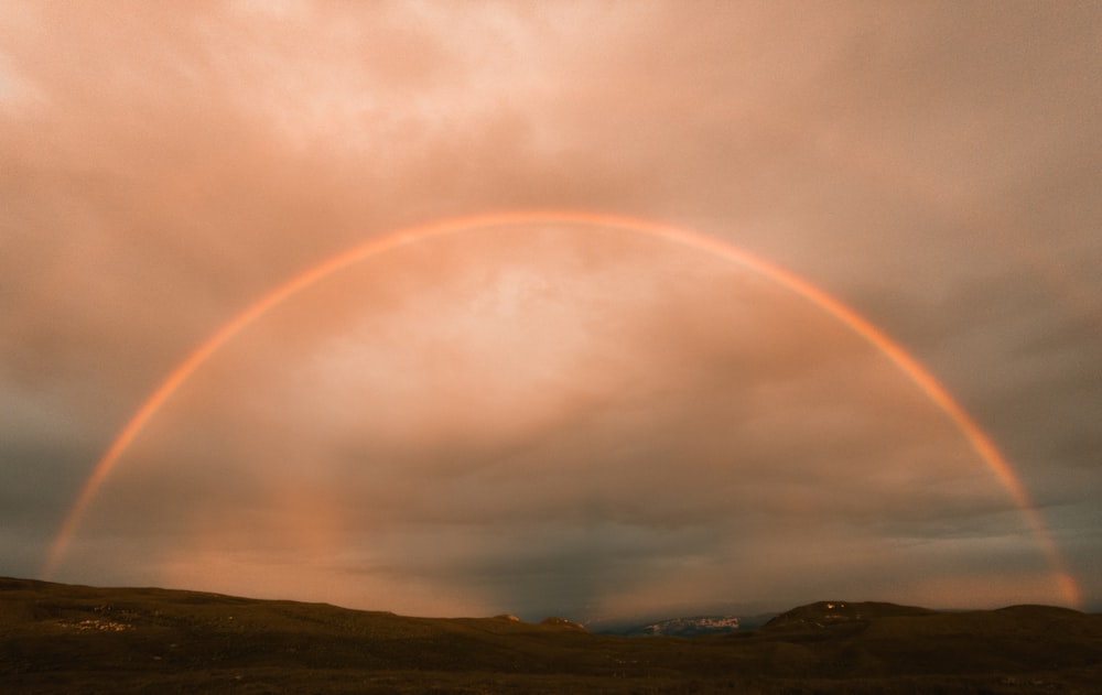 a rainbow over a mountain