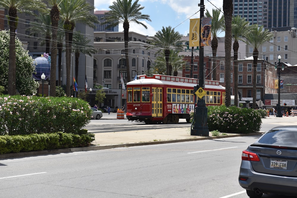 a red trolley on a street