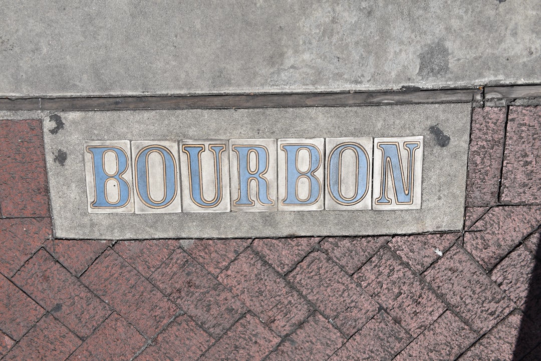 a sign on a brick wall,