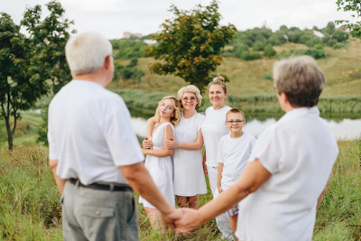 a group of people standing in a field