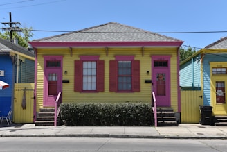 a colorful building with a red door
