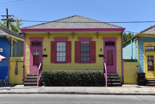 a colorful building with a red door