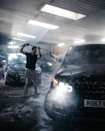 a person standing next to a car