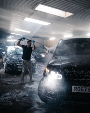 a person standing next to a car