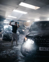 a person standing next to a car