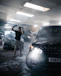 a person standing next to a car