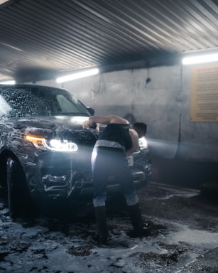a person leaning against a car
