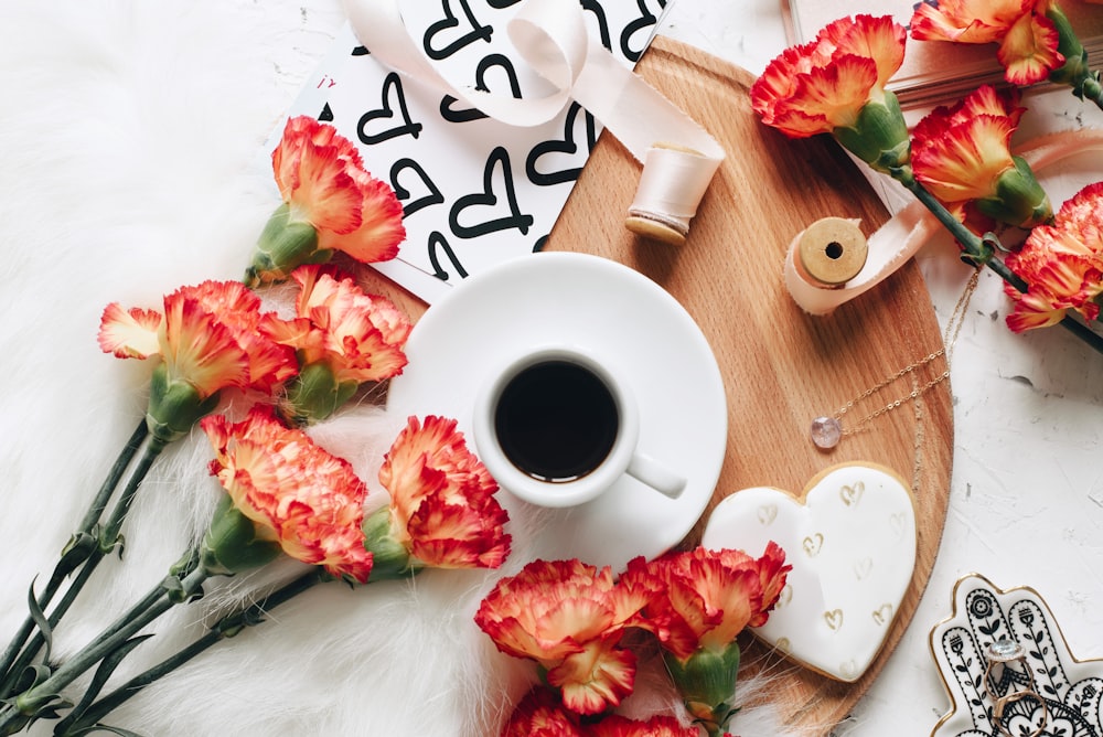 a cup of coffee and flowers