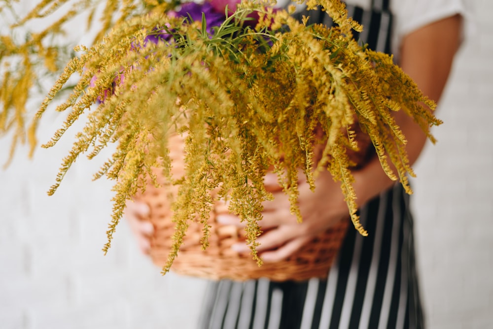 a person holding a bouquet of flowers