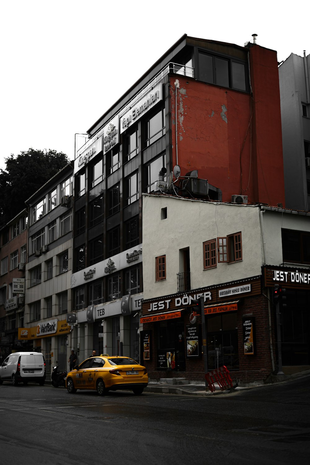 a yellow car parked in front of a building