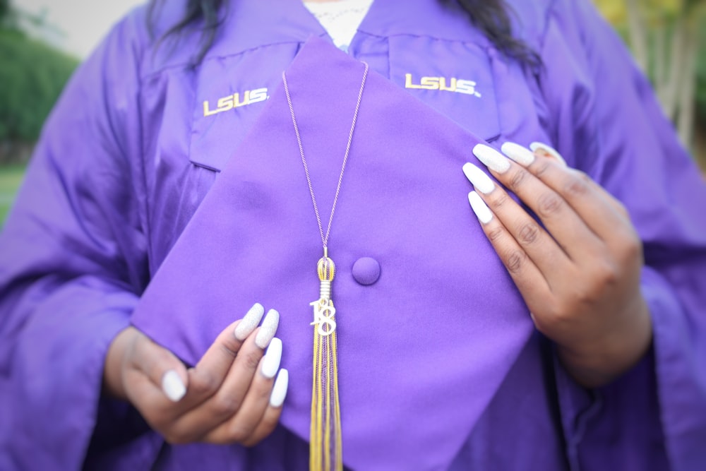 a man wearing a purple robe