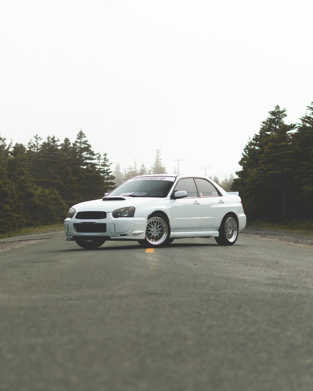 a white car parked on a road