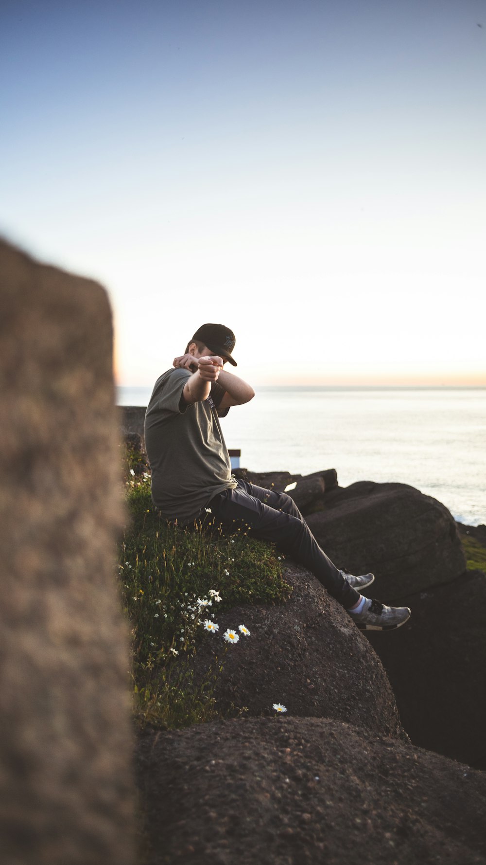 a man sitting on a rock