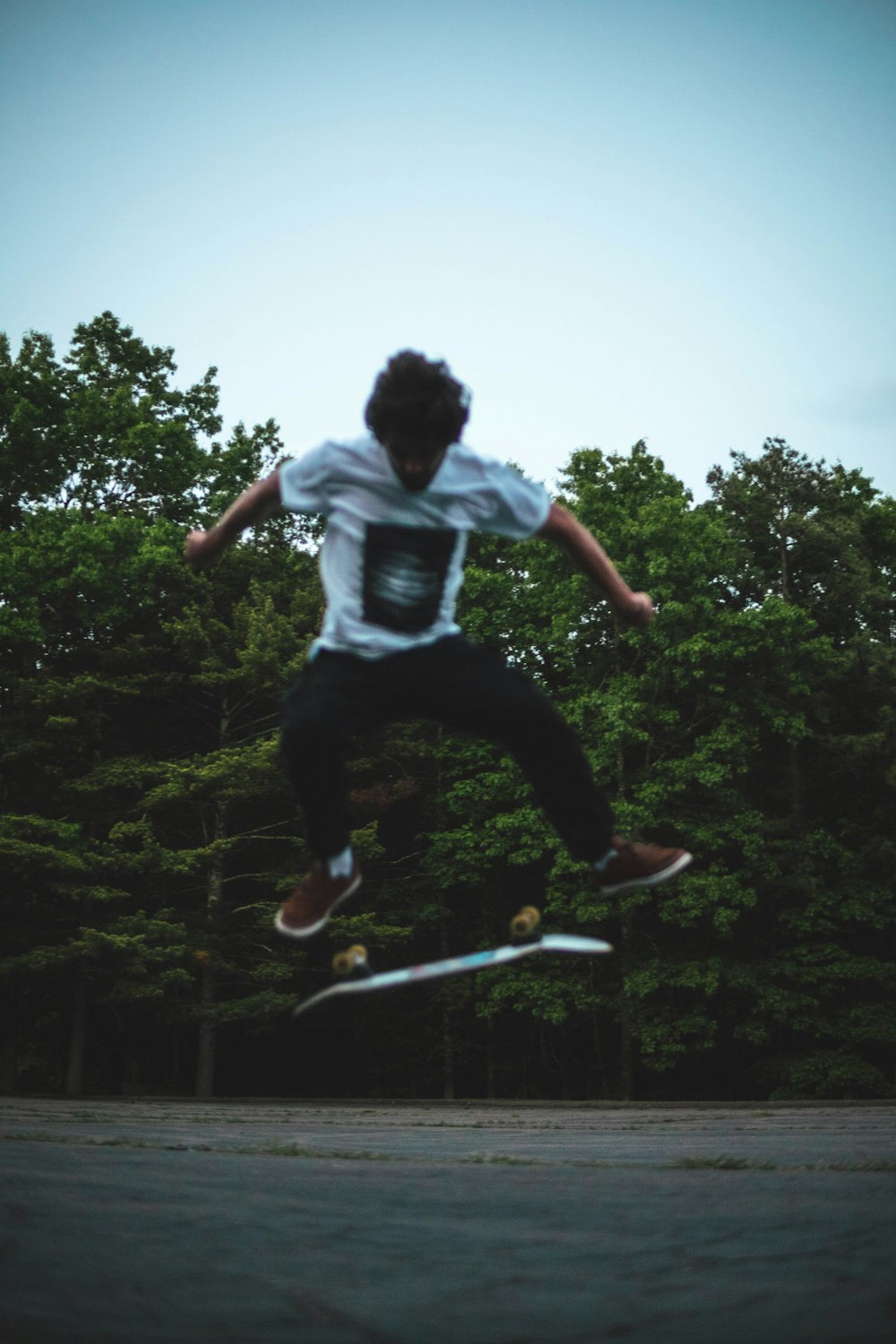 a man jumping in the air on a skateboard